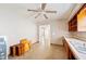 A kitchen needing renovation with wooden cabinets and flooring at 1568 S Lake Shipp Dr, Winter Haven, FL 33880
