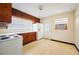 Galley kitchen with wood cabinets and appliances at 1568 S Lake Shipp Dr, Winter Haven, FL 33880