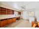 Dated kitchen with wooden cabinets needing updating at 1568 S Lake Shipp Dr, Winter Haven, FL 33880