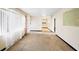 Spacious living room with large windows and carpeted floors at 1568 S Lake Shipp Dr, Winter Haven, FL 33880