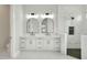 Bathroom boasts double vanity and marble tile at 2116 Sarah Way, Mulberry, FL 33860