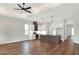 Open living room with hardwood floors and ceiling fan at 2116 Sarah Way, Mulberry, FL 33860
