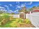 Landscaped backyard with storage shed and privacy fence at 3915 Pipkin Creek Rd, Lakeland, FL 33811