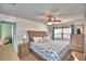 Spacious bedroom with plush bed and large windows at 3915 Pipkin Creek Rd, Lakeland, FL 33811