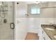 Updated bathroom with a walk-in shower and granite vanity at 425 E Belmar St, Lakeland, FL 33803
