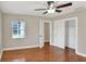 Bedroom with hardwood floors, ceiling fan and closet at 425 E Belmar St, Lakeland, FL 33803