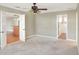 Spacious bedroom with doors to bathroom and hallway at 425 E Belmar St, Lakeland, FL 33803