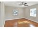 Hardwood floor bedroom with ceiling fan and window at 425 E Belmar St, Lakeland, FL 33803