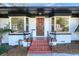 Front entrance with a wooden door and wrought iron railings at 425 E Belmar St, Lakeland, FL 33803