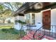 Front entrance with a wooden door and red tile steps at 425 E Belmar St, Lakeland, FL 33803
