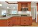 Granite countertop kitchen with wood cabinets at 425 E Belmar St, Lakeland, FL 33803