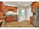 Bright kitchen with tile floors and wood cabinets at 425 E Belmar St, Lakeland, FL 33803