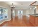 Open concept living and kitchen area with hardwood floors at 425 E Belmar St, Lakeland, FL 33803