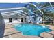 Refreshing screened pool with brick patio and covered enclosure at 425 E Belmar St, Lakeland, FL 33803