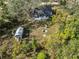Aerial view showing house, shed, and surrounding land at 4925 Magnolia Ave, Mulberry, FL 33860