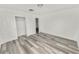 Bright bedroom with vinyl flooring and built-in closet at 4925 Magnolia Ave, Mulberry, FL 33860