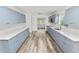 Modern kitchen boasting gray cabinets and white quartz countertops at 4925 Magnolia Ave, Mulberry, FL 33860