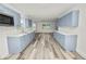 Newly renovated kitchen with gray cabinets and white countertops at 4925 Magnolia Ave, Mulberry, FL 33860