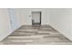 Open living space showcasing neutral walls and vinyl flooring at 4925 Magnolia Ave, Mulberry, FL 33860