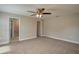 Primary bedroom with ceiling fan and access to bathroom at 5435 Carmen Ln, Lakeland, FL 33810