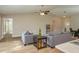 Open floor plan living area with neutral color scheme and hardwood floors at 5435 Carmen Ln, Lakeland, FL 33810