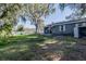 Spacious backyard with a shed and mature trees at 806 Lafayette Ln, Lakeland, FL 33805