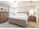King-size bedroom with wood bed frame and dresser at 1839 Daystar Dr, Haines City, FL 33844
