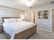 King-size bedroom with wood bed frame and ceiling fan at 1839 Daystar Dr, Haines City, FL 33844