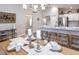 Dining area with wooden table, wicker chairs, and neutral decor at 1839 Daystar Dr, Haines City, FL 33844