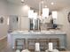 Island kitchen with white cabinets and marble countertops, overlooking dining area at 1839 Daystar Dr, Haines City, FL 33844