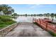 Community boat ramp with wooden docks providing lake access at 2055 S Floral Ave # 146, Bartow, FL 33830