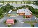 Aerial view of community center, shuffleboard, and lake at 2055 S Floral Ave # 146, Bartow, FL 33830