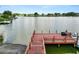 Wooden dock on a lake with a view of the community at 2055 S Floral Ave # 146, Bartow, FL 33830