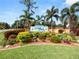 Community entrance with landscaping and signage at 2055 S Floral Ave # 146, Bartow, FL 33830