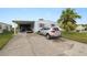 Mobile home with carport, golf cart, and driveway at 2055 S Floral Ave # 146, Bartow, FL 33830