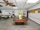 Community game room features a pool table and seating area at 2055 S Floral Ave # 146, Bartow, FL 33830