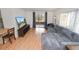 Living room with sectional sofa and access to screened porch at 2055 S Floral Ave # 146, Bartow, FL 33830