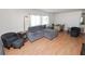 Living room with sectional sofa and wood floors at 2055 S Floral Ave # 146, Bartow, FL 33830