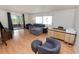 Spacious living room with gray sectional sofa and wood floors at 2055 S Floral Ave # 146, Bartow, FL 33830