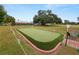 Community putting green with seating area at 2055 S Floral Ave # 146, Bartow, FL 33830
