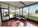 Relaxing screened porch with seating and grill at 2055 S Floral Ave # 146, Bartow, FL 33830