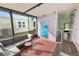 Screened porch with painted door and seating at 2055 S Floral Ave # 146, Bartow, FL 33830