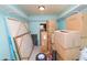 Unorganized storage room with boxes and supplies at 2055 S Floral Ave # 146, Bartow, FL 33830