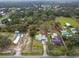 Aerial view of property showing house, outbuildings, and large lot at 210 Wilder Rd, Lakeland, FL 33809