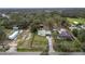 Aerial view of property showing house, outbuildings, and large lot at 210 Wilder Rd, Lakeland, FL 33809