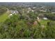 Aerial view of property with wooded area and homes in distance at 210 Wilder Rd, Lakeland, FL 33809