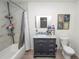 Updated bathroom with marble tile and a modern vanity at 210 Wilder Rd, Lakeland, FL 33809