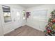 Bright entryway with wood floors and Christmas tree at 210 Wilder Rd, Lakeland, FL 33809