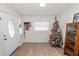 Entryway with wood floors and decorative tree at 210 Wilder Rd, Lakeland, FL 33809
