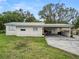 Front view of house and carport at 210 Wilder Rd, Lakeland, FL 33809
